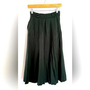 XS High waist, mid length dark green skirt. Used, in good condition.
